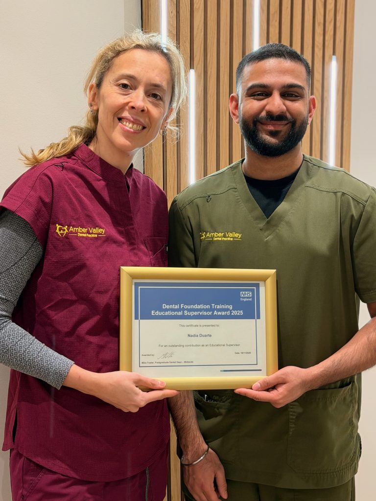 Nadia Duarte holding the Dental Foundation Training Educational Supervisor Award 2025 certificate alongside a Foundation Dentist at Amber Valley Dental Practice.